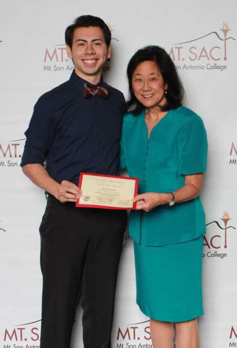Audrey (R) with student getting an award