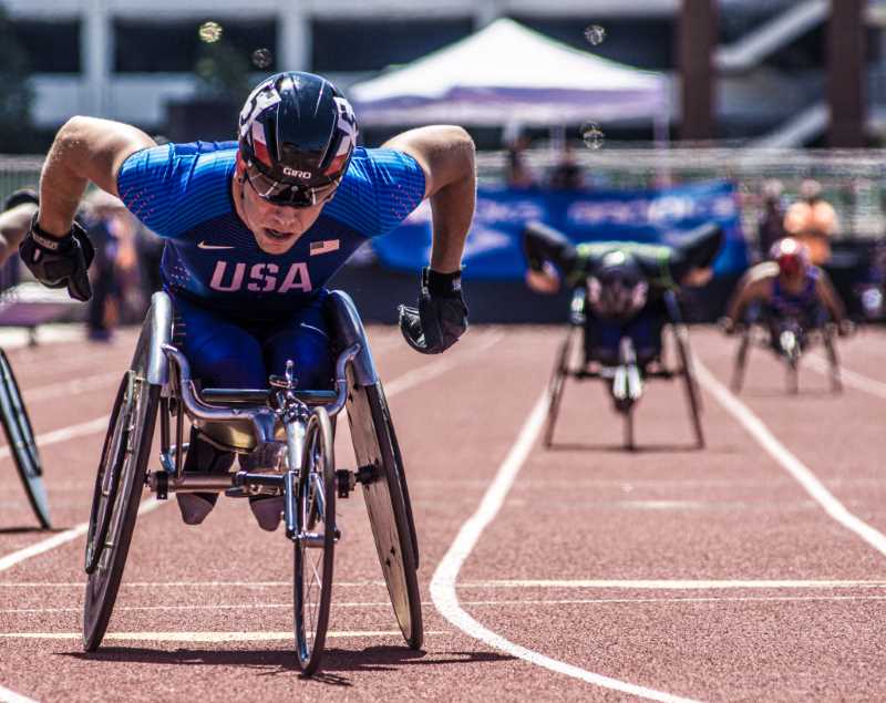Male USA para-competitor races down track - courtesy of Mt. SAC Relays Photographer