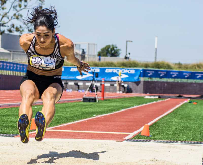 Female competitor flies in air on the long jump - courtesy of Mt. SAC Relays Photographer