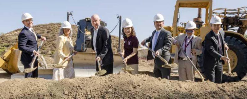 Board of Trustees shovel earth