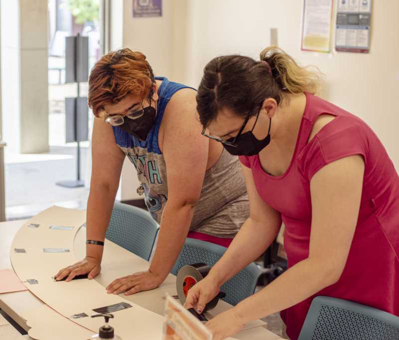 Pride Center students work on sign