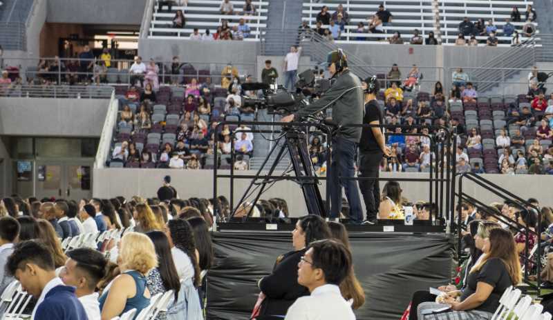 Cameras among the students live broadcasting the event