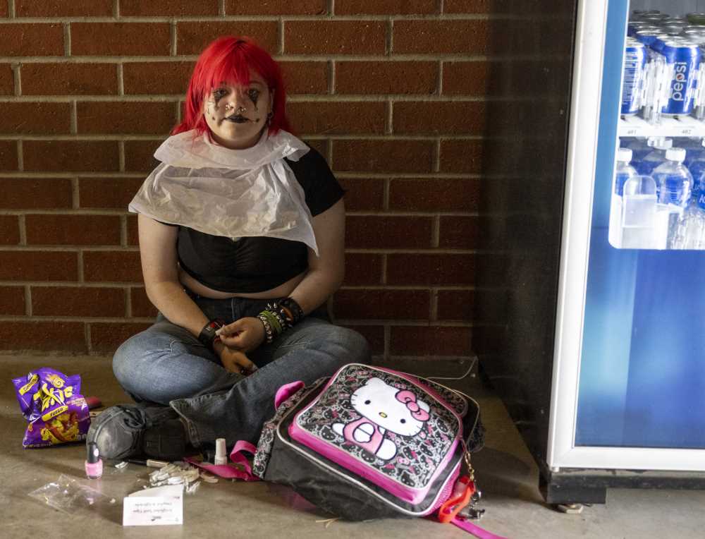 Student sitting in costume