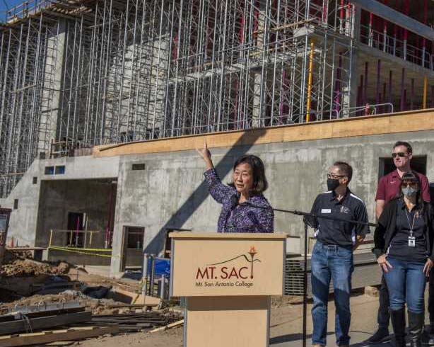 Dr. Audrey Yamagata-Noji points to the under-construction Student Center she has been working on for several years