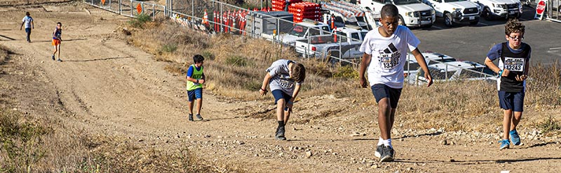 Cross Country runners mount grueling hill climb