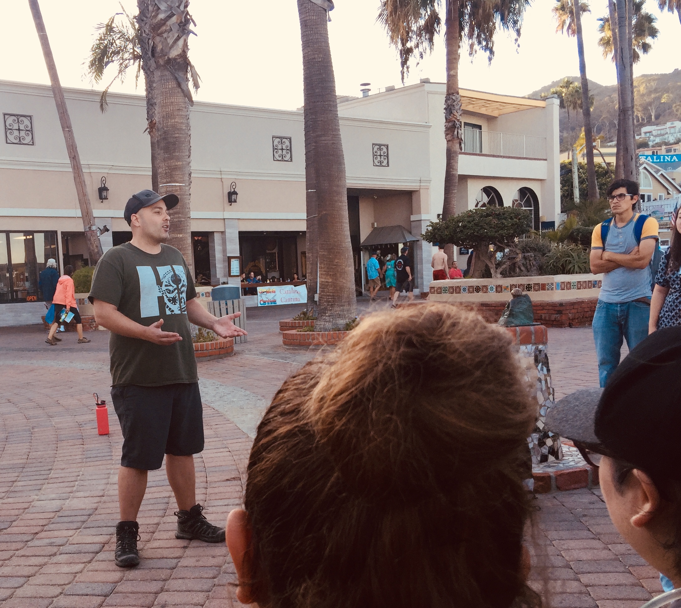 A student delivers a speech to other students at the Avalon public boardwalk.