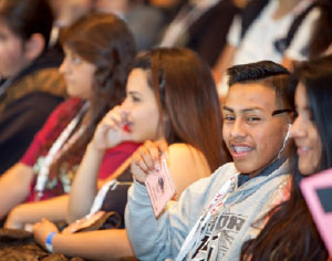 young students smile in class