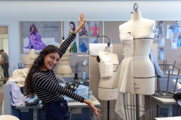 Student in fashion draping class